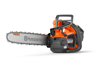 Side view of a Husqvarna chainsaw with ergonomic handle and visible branding.