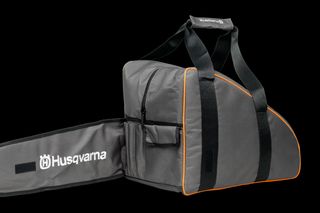 Side view of a Husqvarna chainsaw carrying case with handle and zipper compartments.