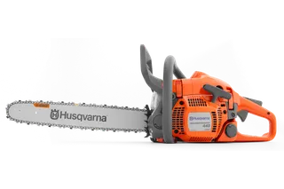 Side view of a Husqvarna chainsaw model 440 with visible chain and ergonomic handle.