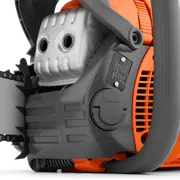 Close-up view of a chainsaw engine and part of the chain bar.