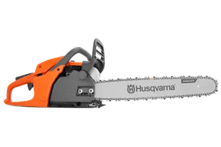 Side view of a Husqvarna chainsaw with visible chain and handle.