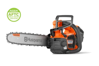 Studio side view of a chainsaw with guide bar and chain; 'AGZA AFTC Certified' badge at top left.