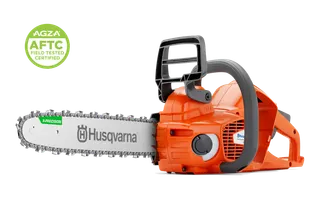 Side view of a Husqvarna chainsaw with guide bar and chain; AGZA AFTC certification badge.