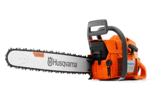 Side view of a Husqvarna chainsaw with visible branding on the blade.