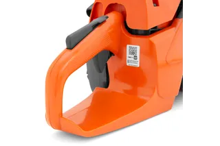 Close-up view of a chainsaw handle with a QR code visible.