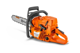 Side view of a Husqvarna chainsaw with a visible chain and handle.