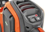 Close-up of a Husqvarna product showing control buttons and a vented design.