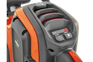 Close-up of a Husqvarna product showing control buttons and a vented design.