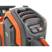 Close-up of a Husqvarna product showing control buttons and a vented design.