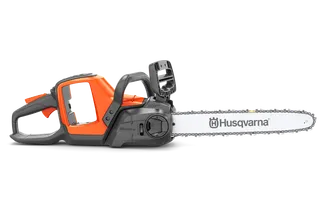 Side view of a Husqvarna chainsaw with visible branding on the blade.