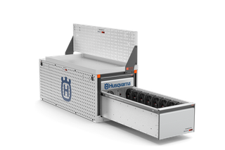 Front view of a Husqvarna storage box with an open drawer displaying organized tools.