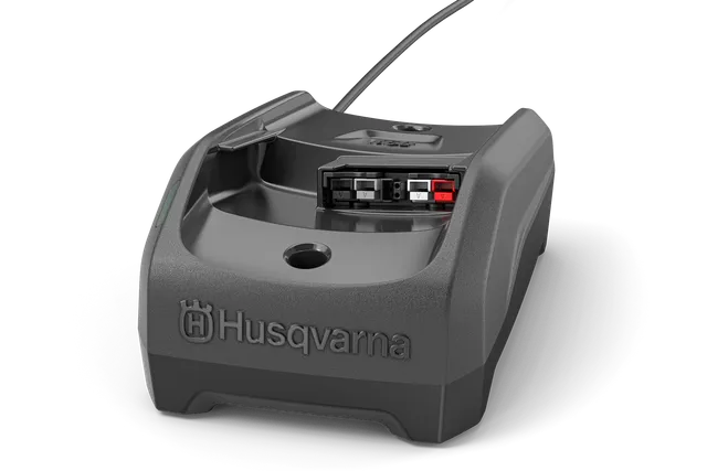 Front view of a Husqvarna battery charger with visible cable.