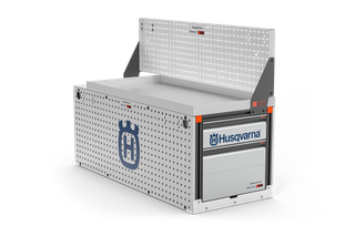 Side view of a Husqvarna storage unit with perforated panels and a drawer.