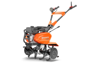 Front view of a Husqvarna garden tiller with multiple blades.