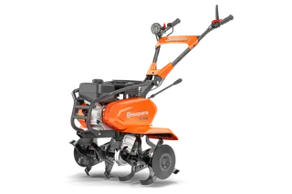 Husqvarna TF 230. Front view of a Husqvarna garden tiller with multiple blades.