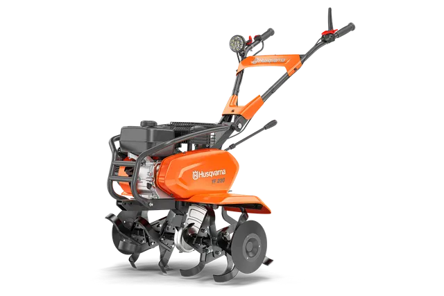 Husqvarna TF 230. Front view of a Husqvarna garden tiller with multiple blades.