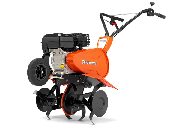 Seitenansicht einer Husqvarna Motorhacke mit sichtbarem Motor und Klingen.