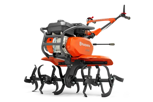 Вид збоку на садовий культиватор Husqvarna з декількома зубцями для обробки ґрунту.