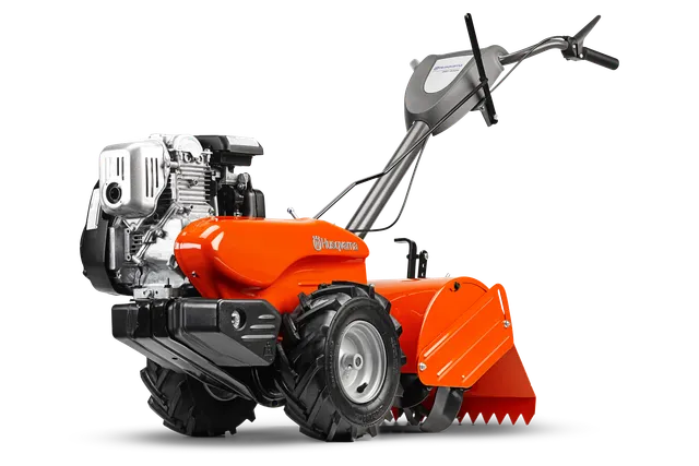 HUSQVARNA DRT900H. Side view of a Husqvarna tiller with large wheels and a robust engine.