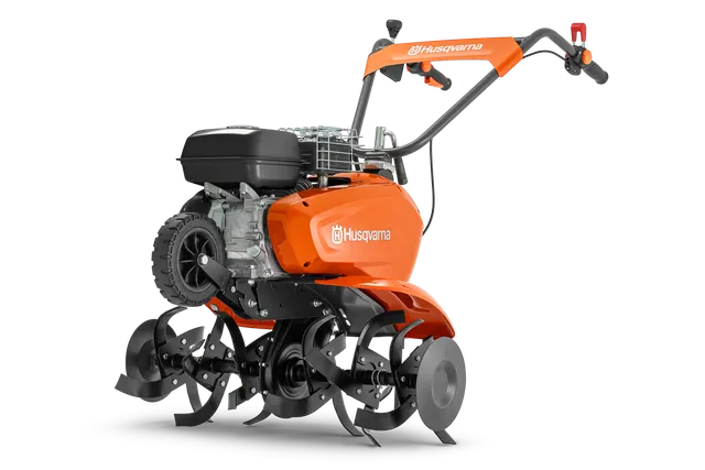 A Husqvarna kormányrúd oldalnézete látható késekkel és motorral.