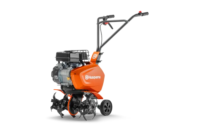 Вид збоку на садовий культиватор Husqvarna з видимими двигуном і ручками.
