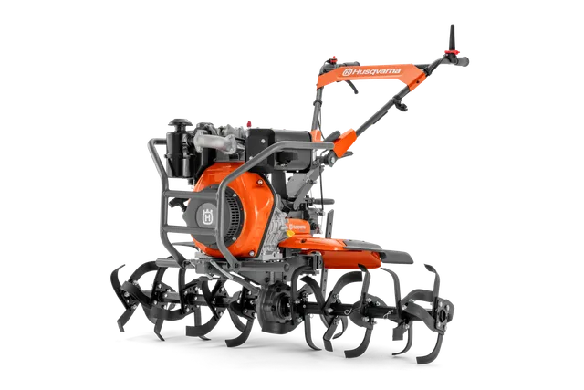 Side view of a Husqvarna tiller with multiple tines and ergonomic handle.
