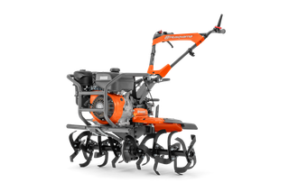 Вид збоку на культиватор Husqvarna з видимими вістрями та двигуном.