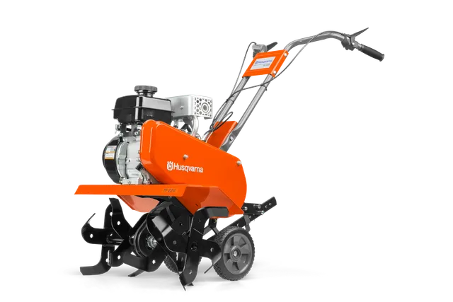HUSQVARNA TF224. Side view of a Husqvarna garden tiller with visible engine and blades.