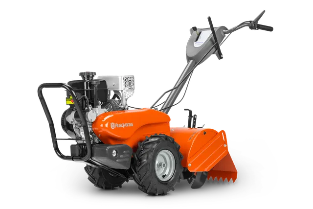 Side view of a Husqvarna tiller with a sturdy handle and robust wheels.