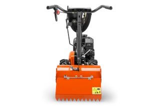 HUSQVARNA TR 430. Vista trasera de un producto de construcción con manillar y etiquetas de advertencia.