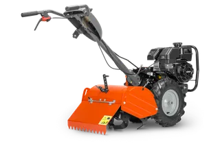 HUSQVARNA TR 430. Vista lateral de una motoazada con un robusto motor y manillar ajustable.