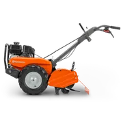 HUSQVARNA TR 430. Vista lateral de una motoazada Husqvarna con el motor y los mangos de control visibles.