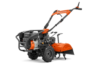 Side view of a Husqvarna tiller showcasing its engine and handle design.
