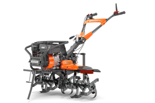 Front view of a Husqvarna tiller showcasing its handle and tines.