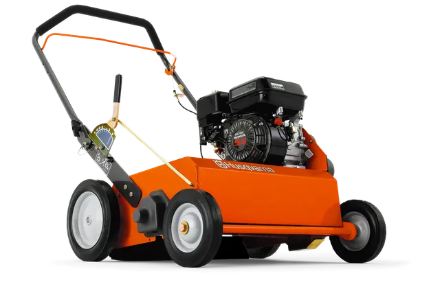 Side view of a Husqvarna lawn scarifier showcasing its engine and wheels.