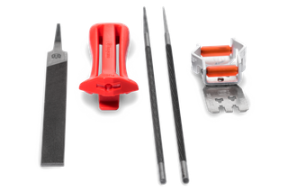 Top view of a chainsaw sharpening kit including files, guide, and depth gauge.