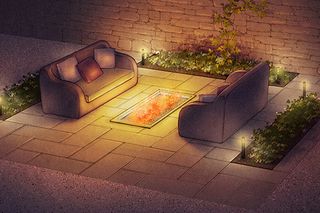 Outdoor patio setting with two sofas facing a rectangular fire pit, surrounded by greenery and ambient lighting.