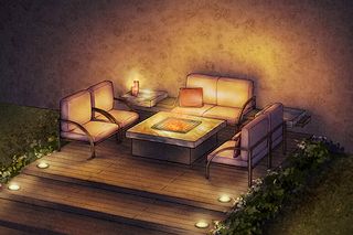 Outdoor seating area with a fire pit table and ambient lighting.