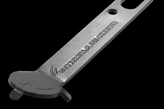 Top view of a Husqvarna Fleet Services tool with a forked end and a hole for hanging.