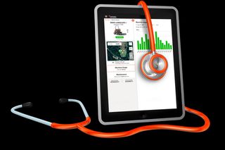 Tablet displaying machine usage statistics with a stethoscope wrapped around it.