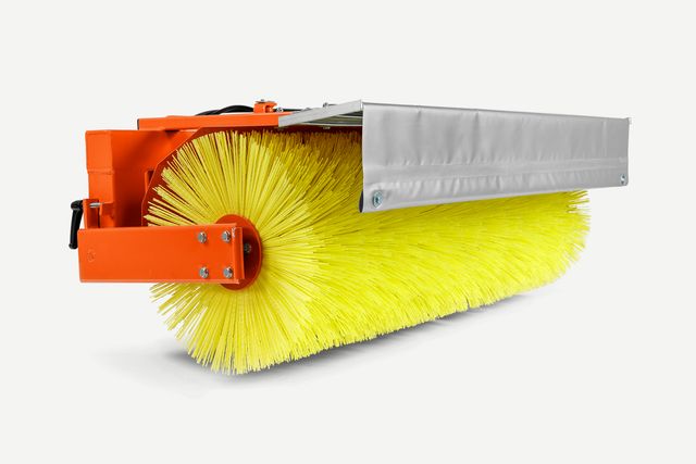 Vue latérale d’une brosse de construction avec poils jaunes.