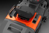 Top view of a ride-on mower seat and control area.
