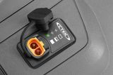 Close-up of a CTEK battery charger connector with indicator lights.