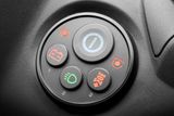 Close-up of a control panel with various function buttons, including battery and light indicators.