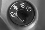 Close-up view of a control dial with stop, start, and other symbols.