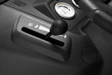 Close-up of a control lever on a machinery dashboard with a temperature gauge.