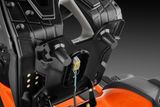 Close-up of a Husqvarna ride-on mower seat with visible wiring and mounting points.