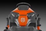 Front view of a Husqvarna ride-on mower showcasing its steering wheel and control panel.
