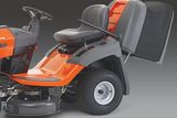 Side view of a ride-on lawn mower with a grass collection bag.