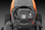 Top view of a Husqvarna ride-on mower's steering wheel and control panel.